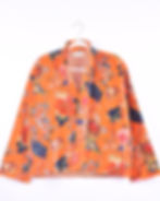 orange velvet jacket with tropical flowers printed on it - front view