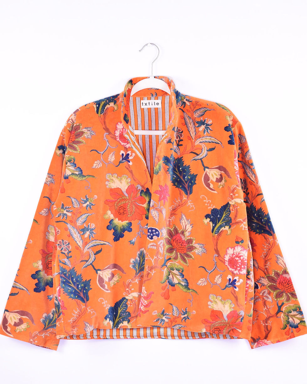 orange velvet jacket with tropical flowers printed on it - front view