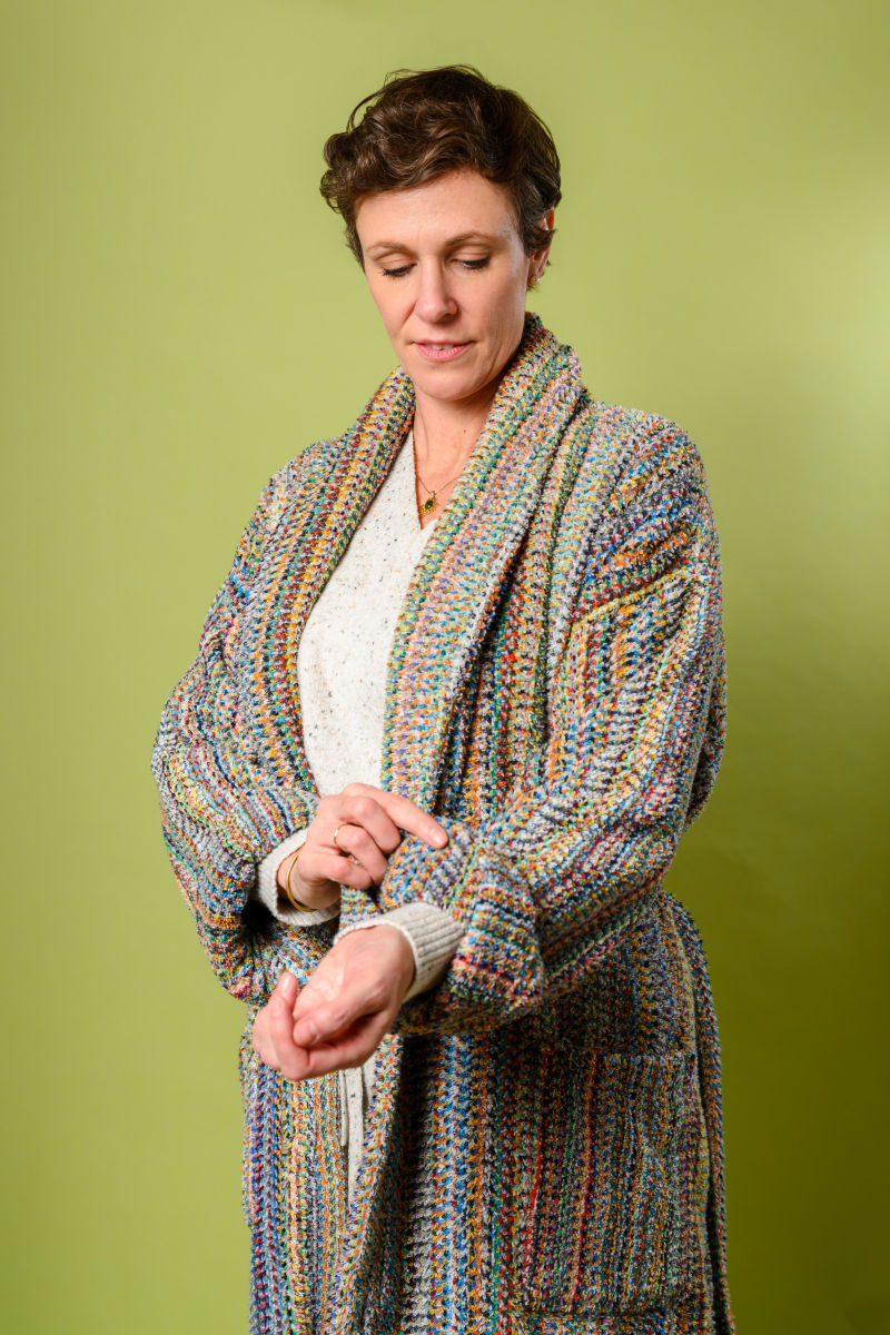 Person wearing Terry cloth robe made from colorful threads - zoom view