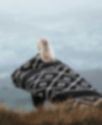 Large oversized Beyond Borders Collective black and cream blanket.