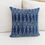 Thumbnail: Indigo shibori print pillow on a bed