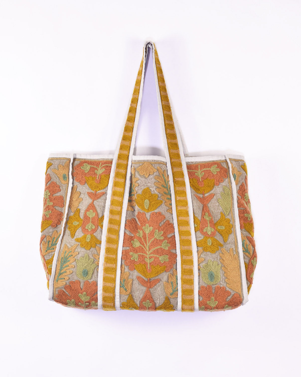 light grey canvas tote bag covered in autumn colored embroidery - front view