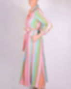 Thumbnail: person wearing shirt dress made of a green and bright pink woven fabric - side view