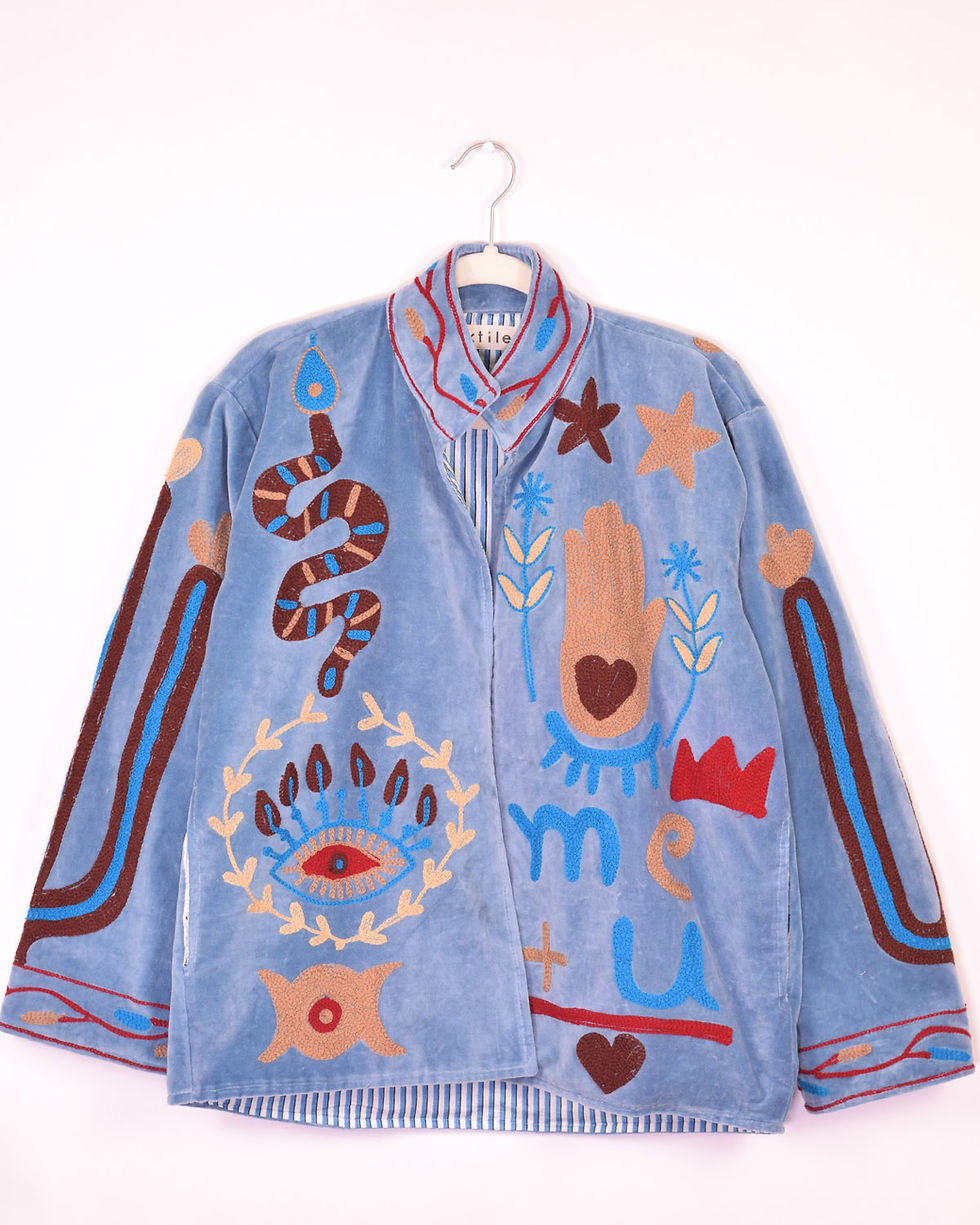 light blue velvet jacket covered in fun embroidery - front view