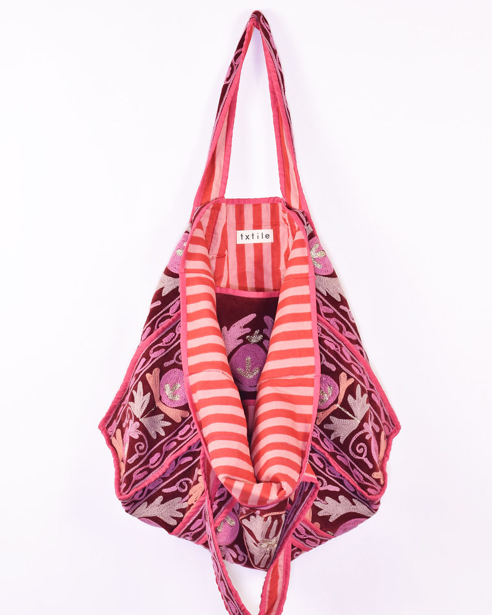 red velvet tote bag covered in pink embroidery - inside view