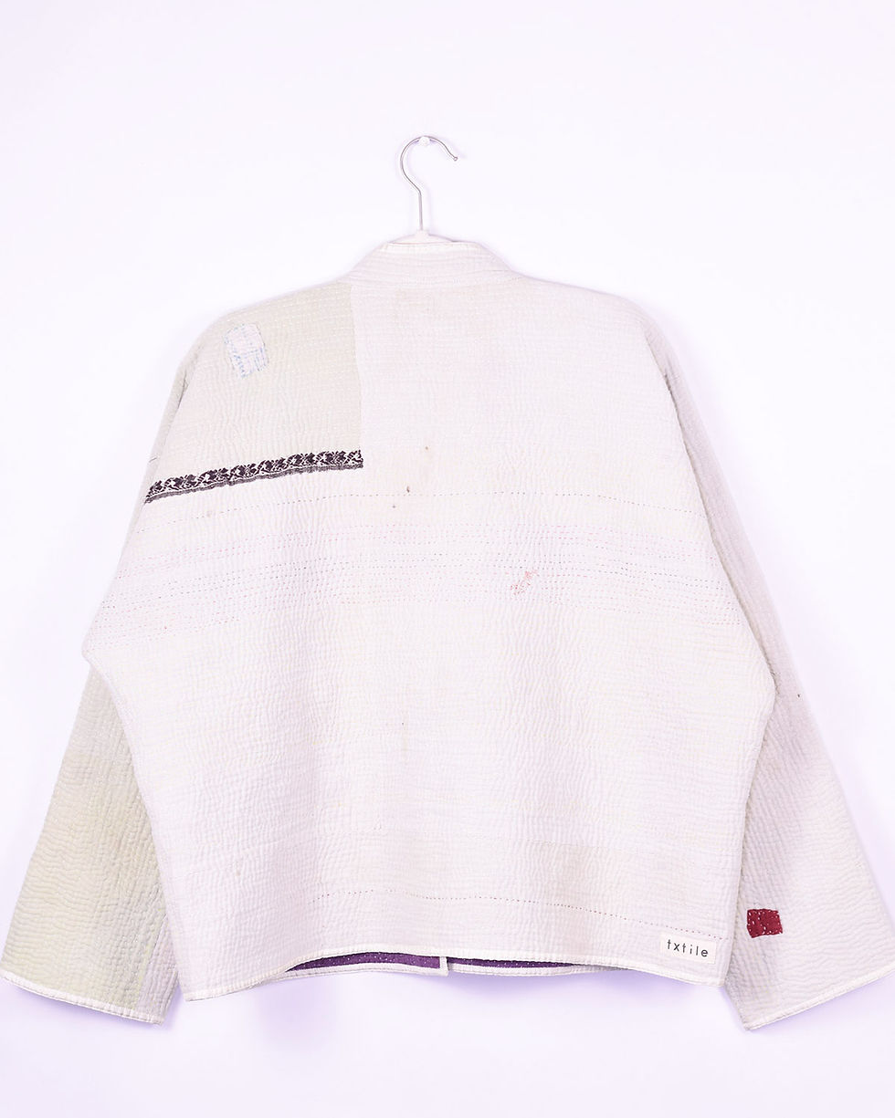 Oversized jacket made from a white kantha quilt