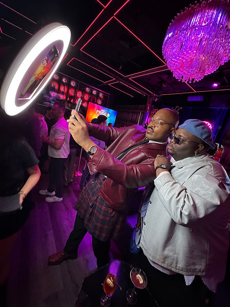 Roamer photo booth capturing vibrant moments at a Pride event, with guests celebrating in rainbow attire and LED lighting enhancing the experience.
