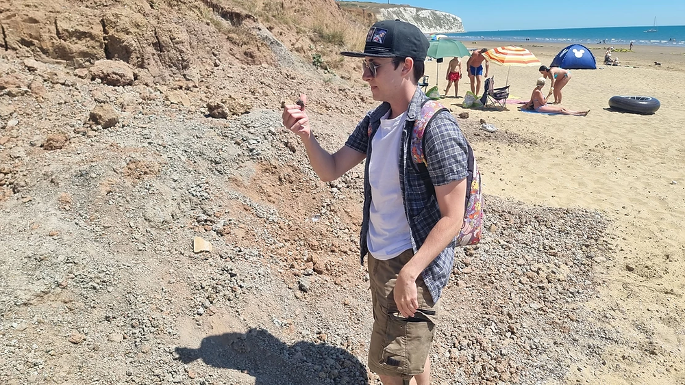 Image of Dan searching through the Cretaceous upper greensands on Yaverland beach