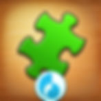 A round icon for Jigsaw Puzzle, green puzzle piece on a wood background.