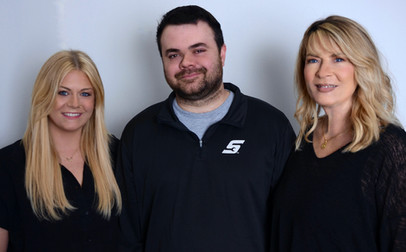 two blond ladies and one dark haired male