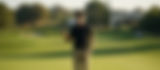 Man on golf course with a driver club