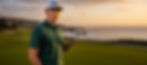 Golfer on course with ocean view at sunset