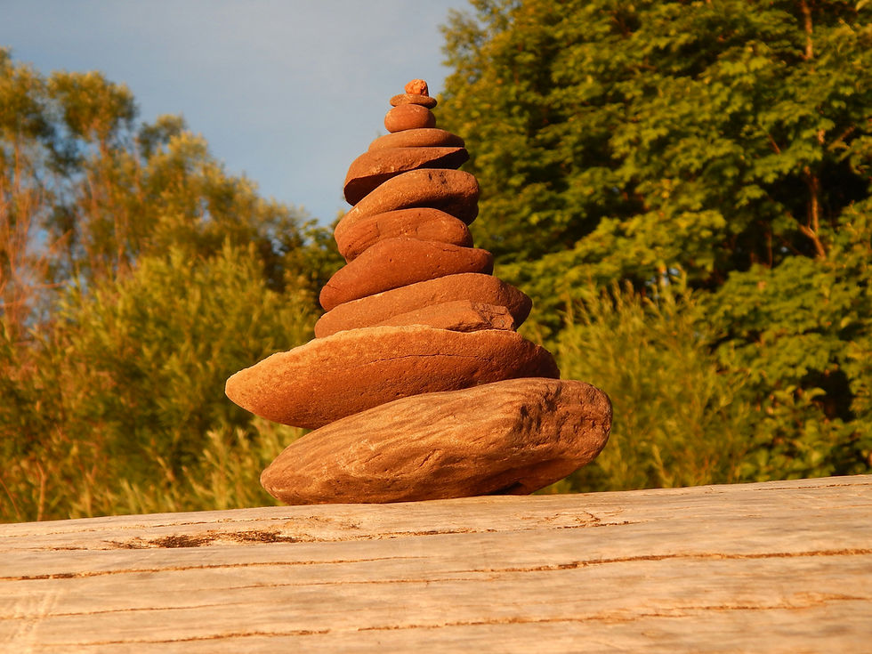 Rocks stacked on each other at sunset.