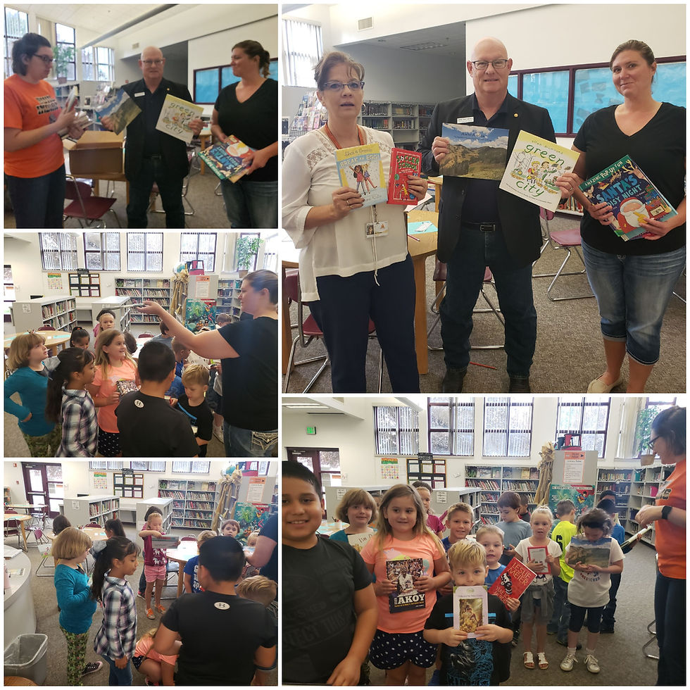 PES students receiving books from the Surplus Book Program through the Library of Congress.