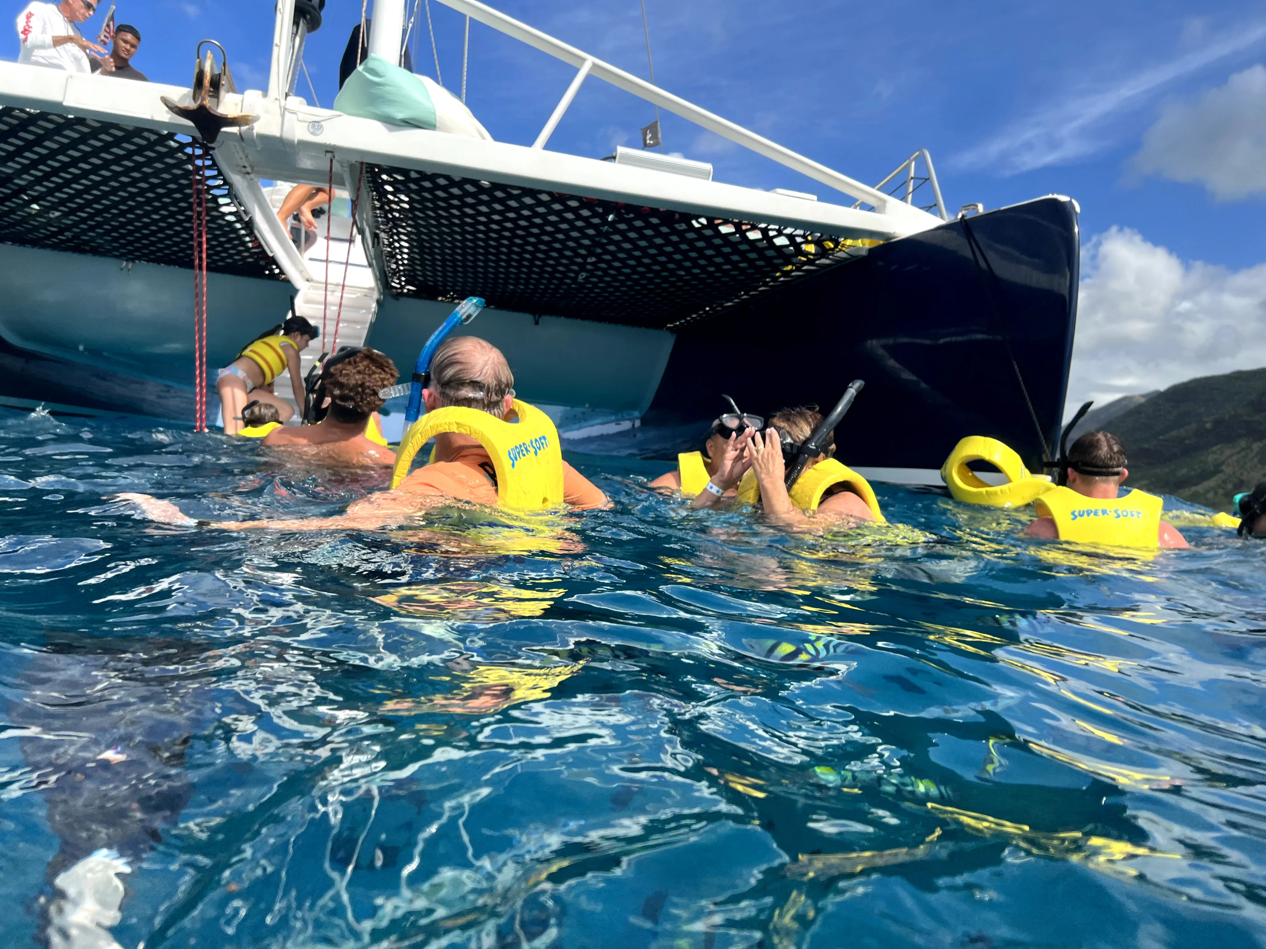 In the water looking for fish, snorkeling in Hawaii, Ko Olina Ocean Adventures.