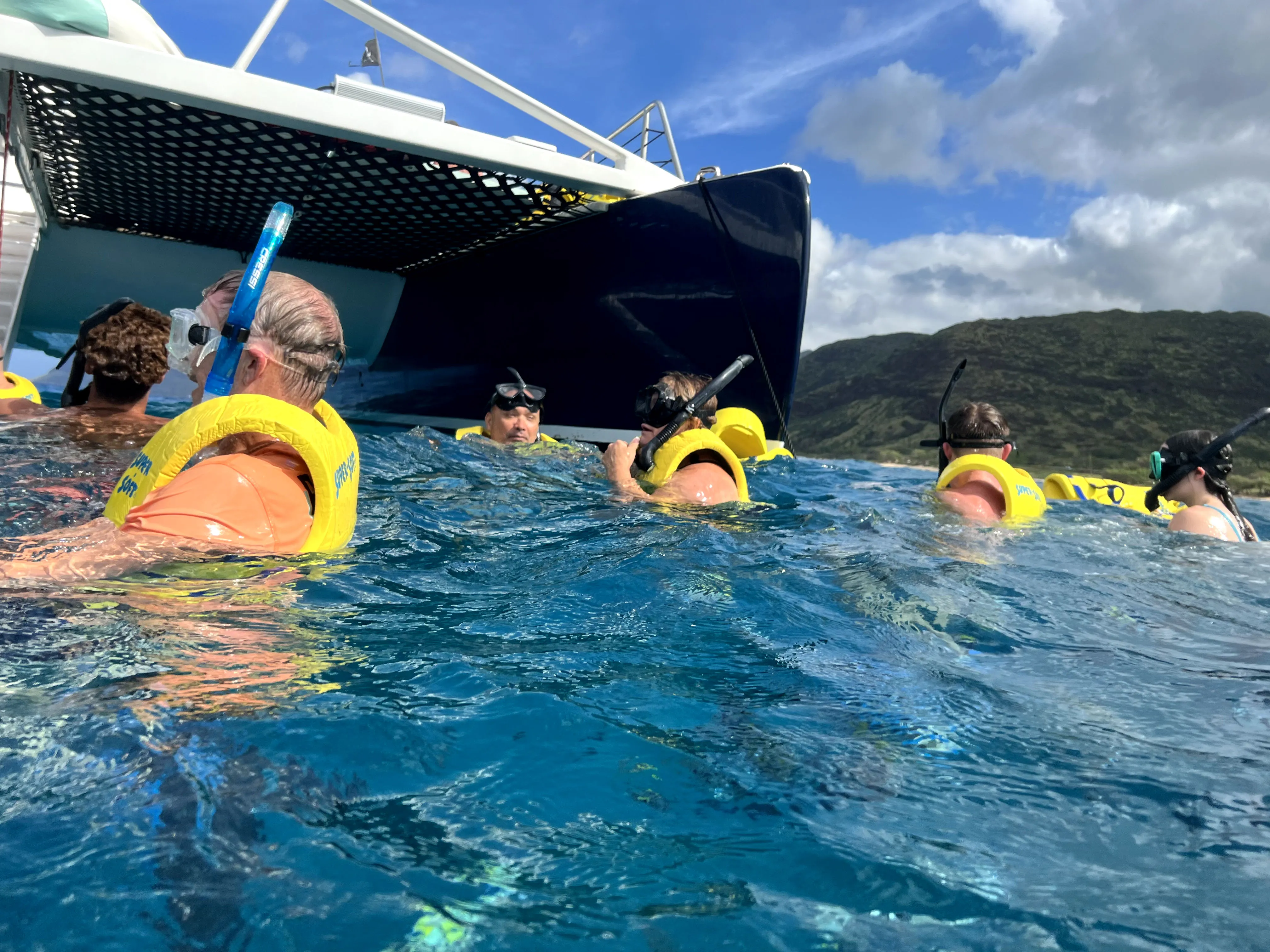 swimming in ocean, off of boat, snorkeling in Hawaii, Ko Olina Ocean Adventures.
