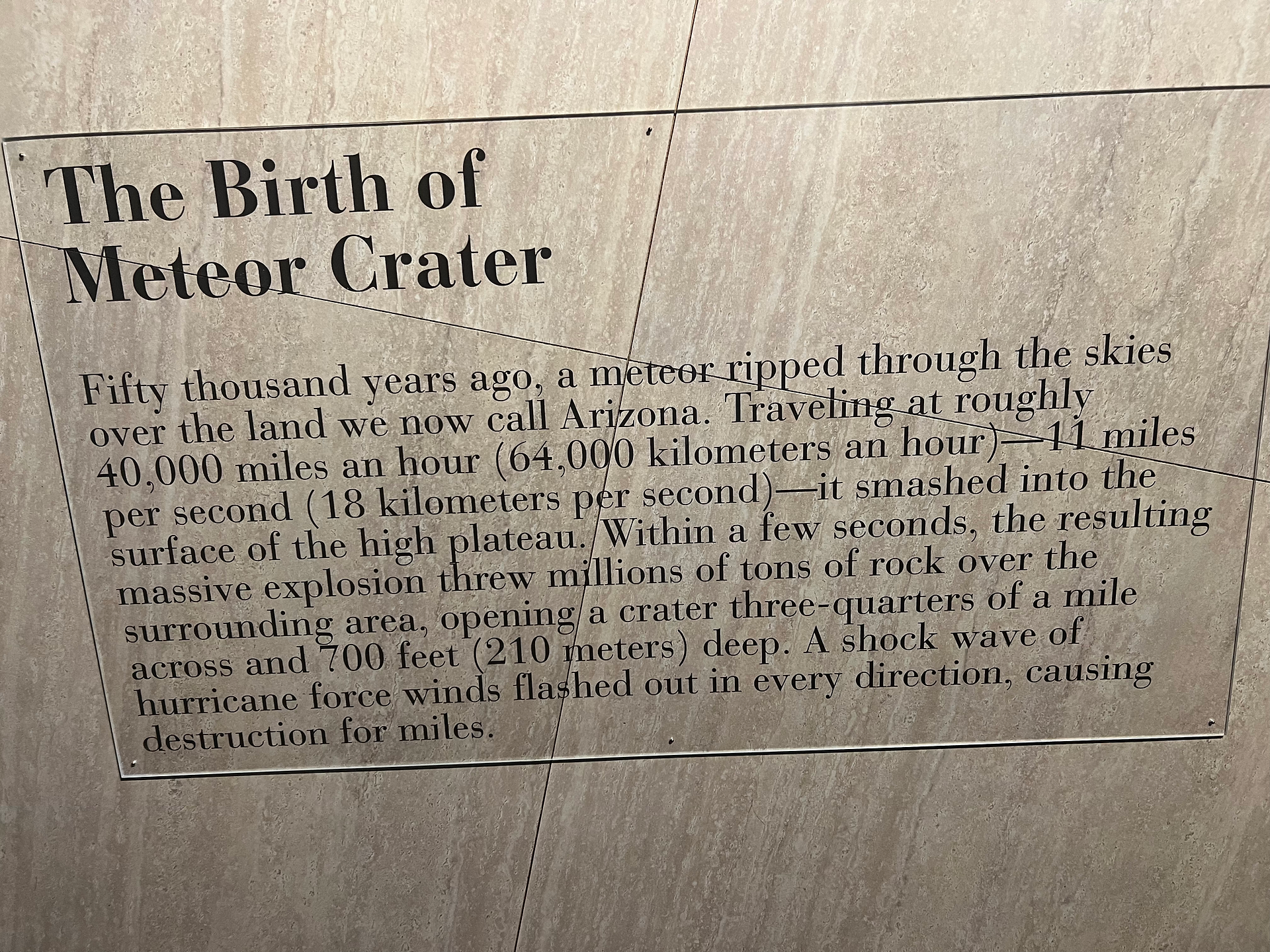 A plaque talking about the birth of meteor crater.