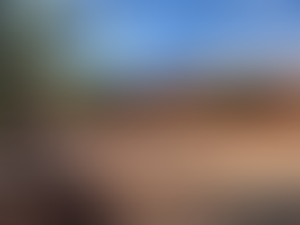 Cabins and picnic area surrounded by red rock hills at Goulding’s Campground near Monument Valley, Utah — sunny morning view from The TinMan Adventures Utah family road trip.