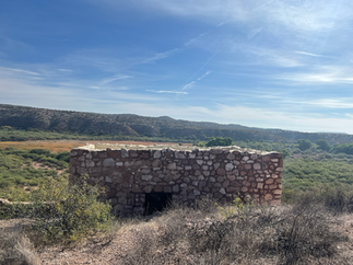 Stone structure at Tuzigoot National Monument overlooking the Verde Valley near Clarkdale, Arizona — ancient Sinagua ruins surrounded by desert landscape captured during The TinMan Adventures Utah to Arizona road trip.