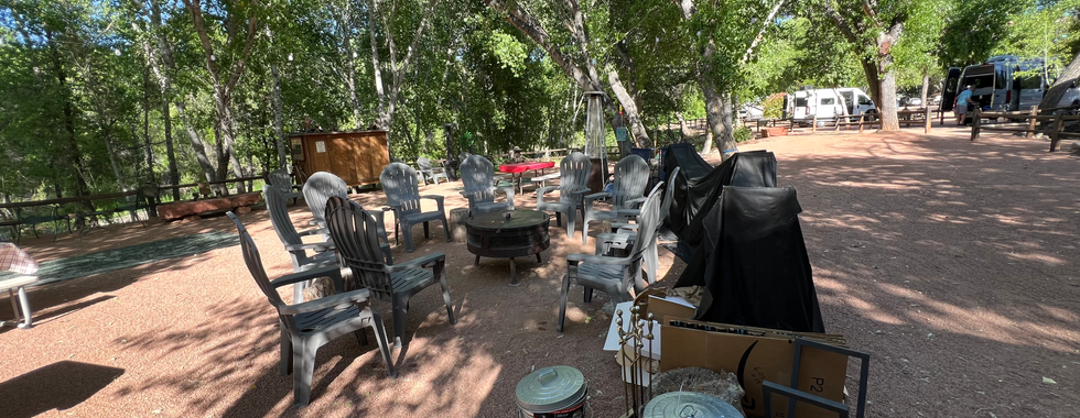 Fire pit and chairs for socializing at rv park. 