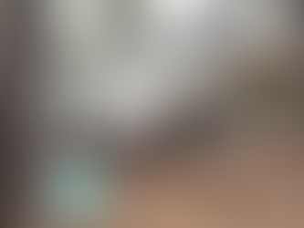 Relaxing under the pines at Woody Mountain Campground in Flagstaff, Arizona — RV campers enjoying coffee beside their fifth-wheel trailer during The TinMan Adventures Utah to Arizona road trip.