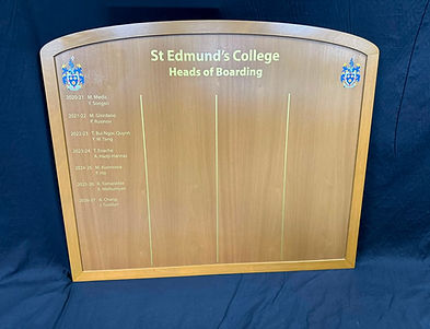 St Edmund's College Heads of Boarding wooden honours board with arched top, gold lettering and twin college crests.