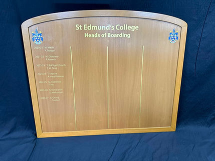 St Edmund's College Heads of Boarding wooden honours board with arched top, gold lettering and twin college crests.