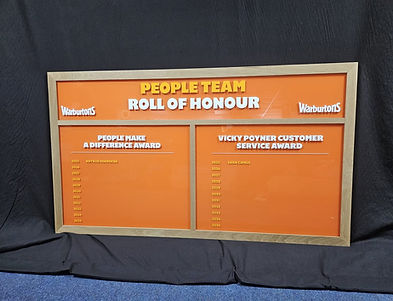 Warburtons People Team Roll of Honour acrylic board with orange panels, oak frame and dual award sections.