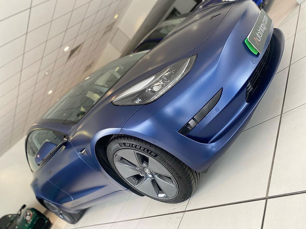 Front view of Blue Tesla with paint protection