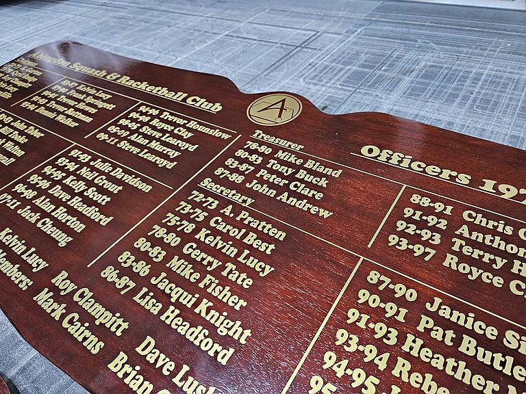 Close-up of matched honours board with gold lettering