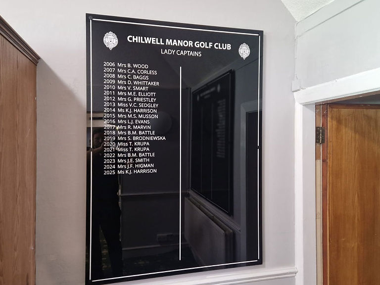 Close-up of Chilwell Manor Golf Club Lady Captains honours board with white lettering on black acrylic.
