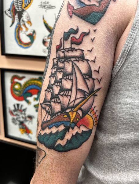 Traditional tattoo of a stormy ocean with a sailing ship