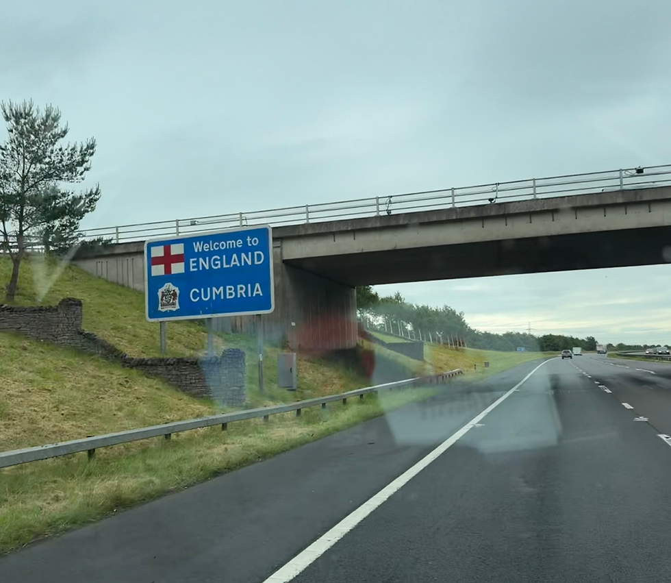 Ed Kowalski Removals travelling from Edinburgh to Exeter, Devon, after completing a long-distance removal from Scotland to England, passing the Welcome to England – Cumbria road sign on the motorway. Professional long distance removals across the UK.