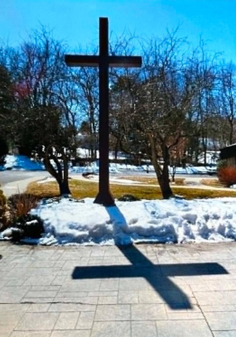When construction neared completion in 1973, parishioners were greeted by one of the most architecturally distinctive churches in Cheshire.
The building featured a dramatic stained-glass mosaic covering the upper portion of its front façade, created by the noted artistic team of Jonyas and Shepherd of Hollis, New York.
Inside, the sanctuary reflected the liturgical changes introduced after the Second Vatican Council.
Suspended above the altar hung an innovative wooden cross portraying the Risen Christ rather than the traditional crucified figure, emphasizing resurrection and hope.
Instead of carved Stations of the Cross, the walls displayed beautifully hand-woven tapestry scrolls created by Sister Maria Edward of the Sisters of Mercy in Madison, Connecticut, giving the sanctuary a distinctive artistic character.