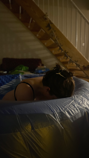 Woman labouring in a birthing pool during a water birth