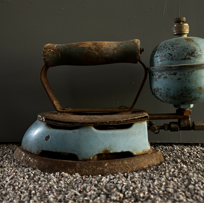 Robin's egg blue flatiron or flat iron used as a doorstop in a preferred lodging hotel.