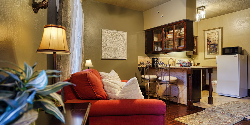 Couch in living room of Suite 202 in the FlatIron historic sandstone inn - Hot Springs, South Dakota
