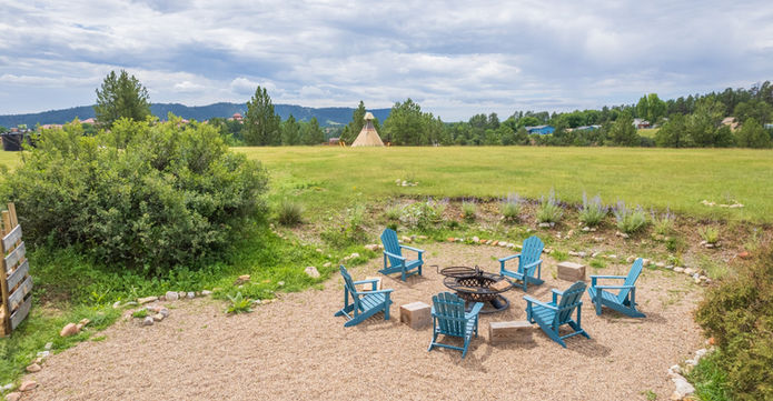 Fire pit at Highland Meadows Resort. Adirondacks and luxury vacation stay.