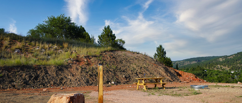 Tent camping site with picnic table at Highland Meadows Resort in Hot Springs, SD.