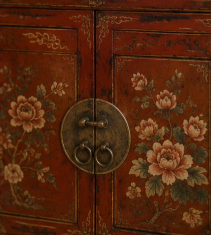 Red hand-painted Chinese cabinet with gold detailing placed in a formal Dubai hallway with marble flooring and warm lighting.