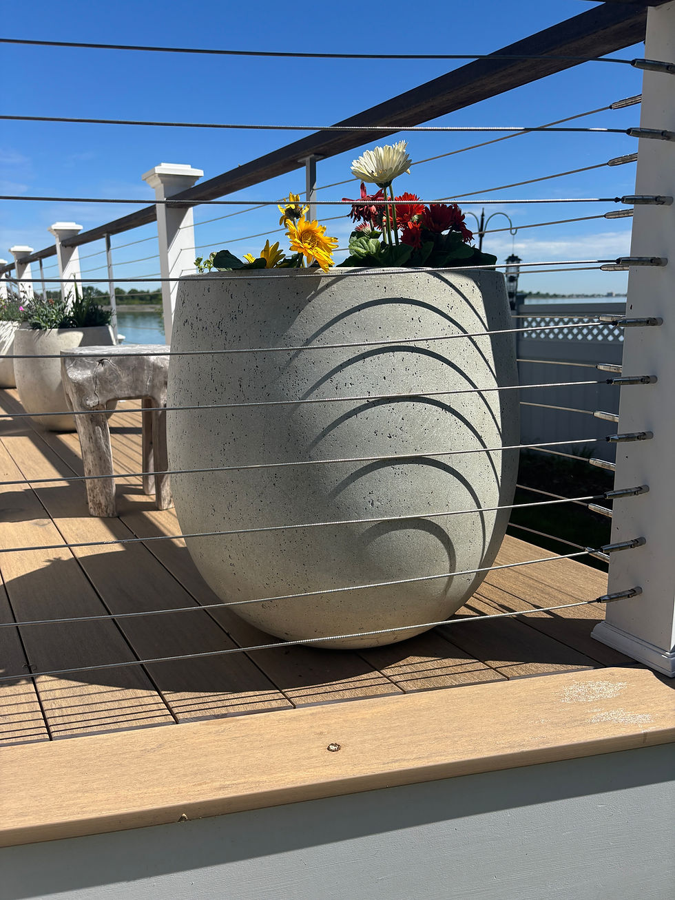 Pair of planters (on deck) w/gerber daisies - $350