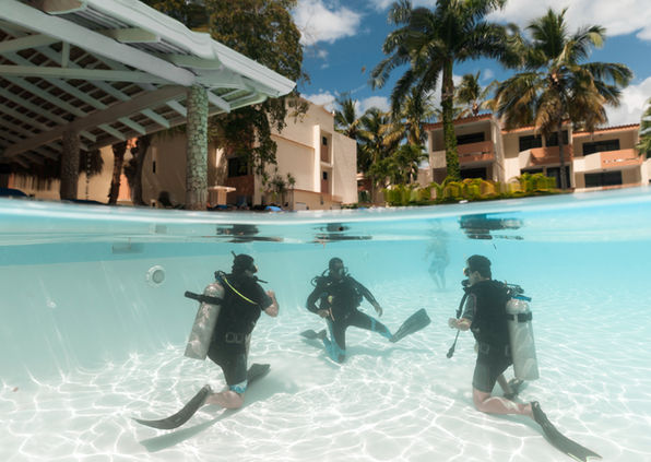 An Instructor candidates practices teaching skills to fellow candidates during a PADI IDC