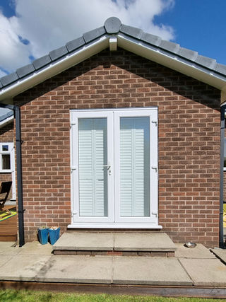 Full height door shutters silent tilt, exterior, Padiham Lancashire 