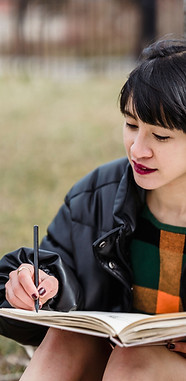 Woman writing poetry SoulHAVEN Artist Retreats