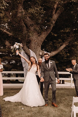The bride and groom celebrate as they just said 'I do.'