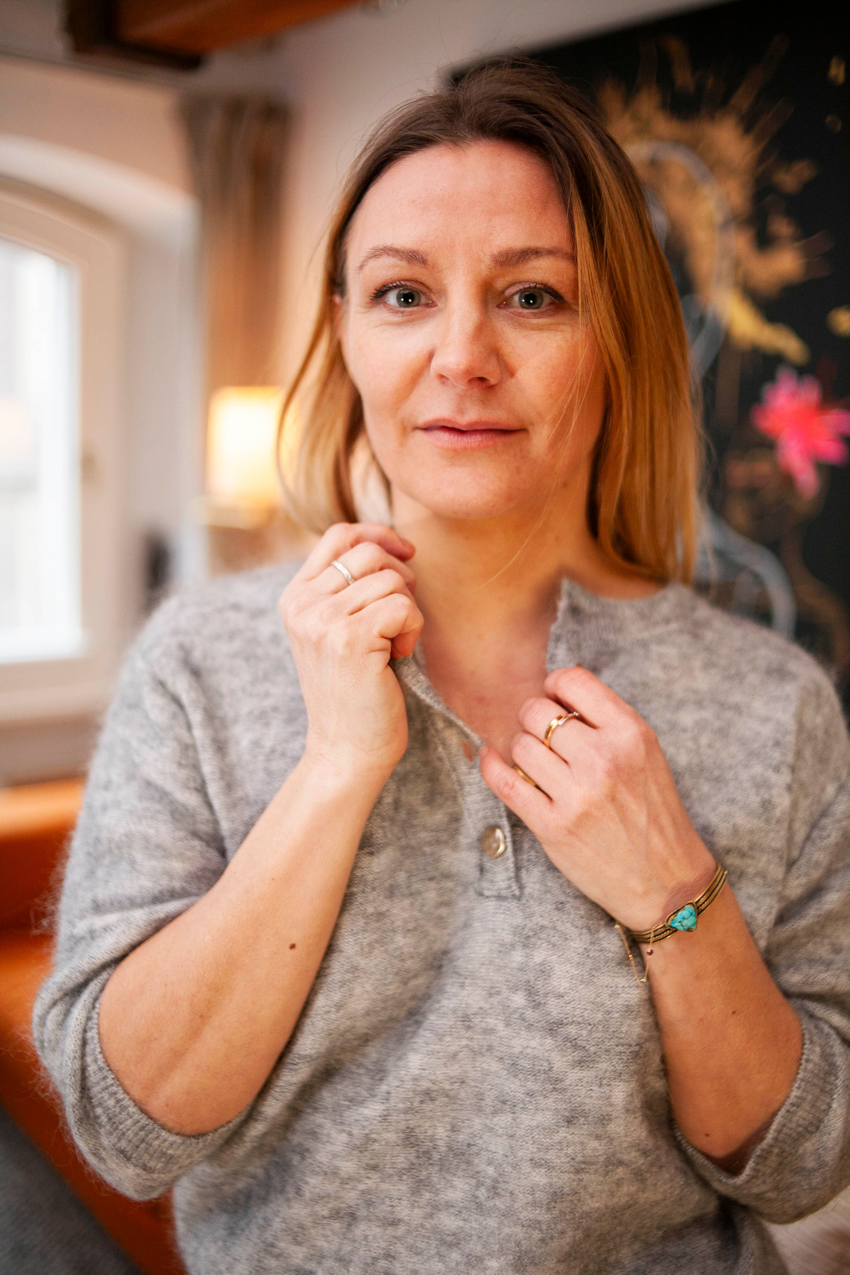 Grey sweater buttons