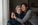 Older adult with a family caregiver at home in the evening