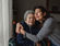 Older adult with a family caregiver at home in the evening
