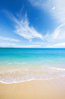 teal ocean horizon with calm waves on beach, soft sand; perfect background for prayer cards