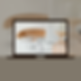 Laptop showing a pair of glasses, a notebook, a sand timer, a phone, and a pencil on the screen.
